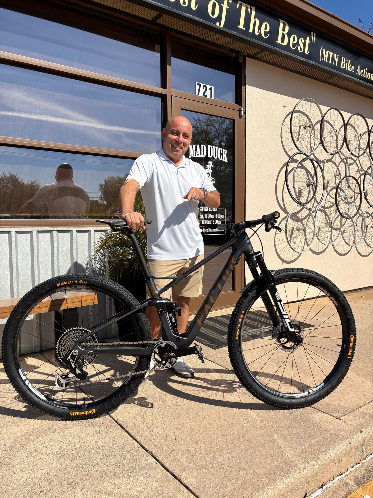 Armando with his Factor LANDO XC mountain bike outside Mad Duck Cyclery